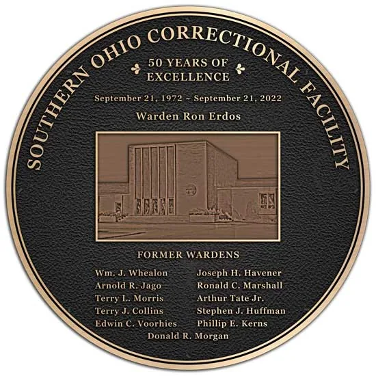 A circle shaped bronze used for a new correctional facility dedication plaque.