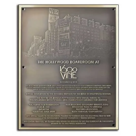 A bronze building dedication plaque example.