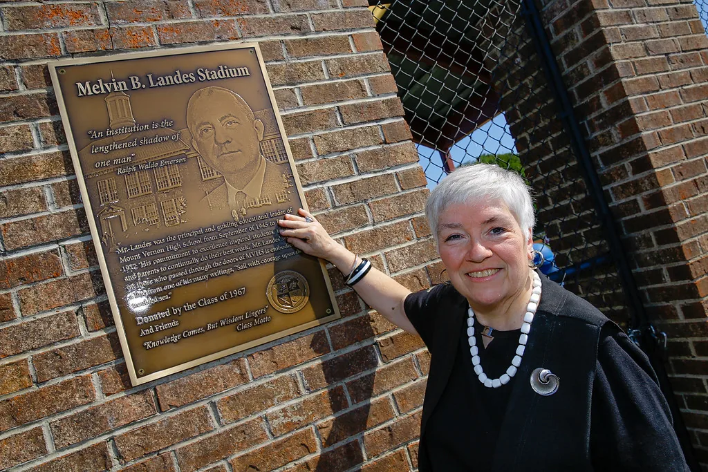 A bronze building dedication plaque.
