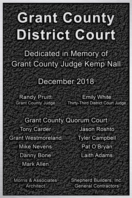 Interior courtroom bronze plaques.