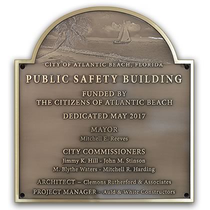 a bronze public safety building dedi
